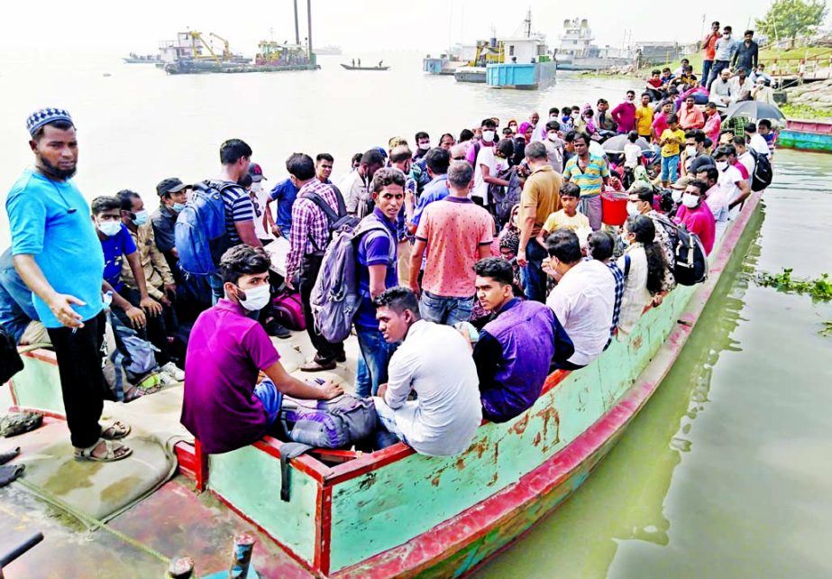 People take a risky ride on a small boat to cross over the Buriganga River from Keraniganj during an indefinite strike by water transport workers on Thursday.