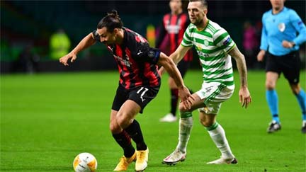 AC Milan's Zlatan Ibrahimovic looks to break past Celtic's Shane Duffy during the Europa League football match between AC Milan and Celtic on Thursday.