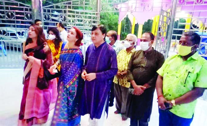 Barishal Divisional Commissioner Amitabh Sarkar and his family visit a Puja Mandap in Agailjhara in the district on Sunday.
