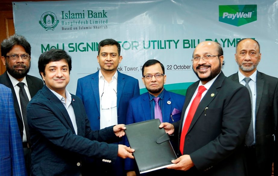 Md. Omar Faruk Khan, AMD of Islami Bank Bangladesh Limited and Mohammad Kudratullah, Chief Marketing Officer of CloudWell Limited, exchanging an agreement signing document at the banks head office on Tuesday. Under the deal, CloudWell will facilitate the