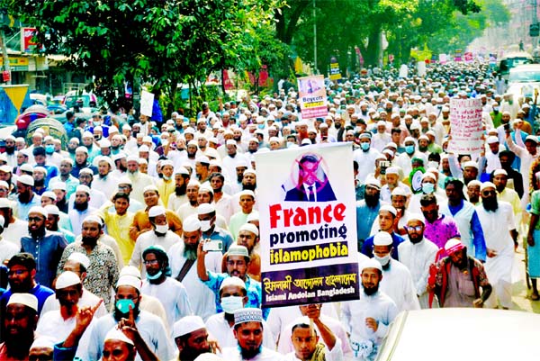 Thousands of angry protesters stage a demonstration on Tuesday in Dhaka in protest against depicting Prophet Muhammad in France.
