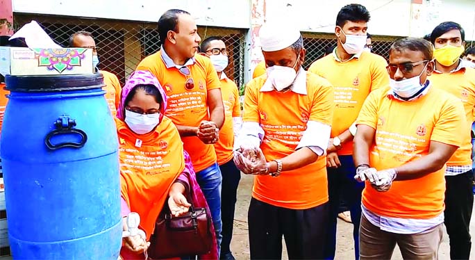 Advocate Shah-E-Alam Bachchu, Upazila Chairman of Morelganj in Bagerhat along with UNO Md Delwar Hossain are seen at a handwashing demonstration at the office of Department of Public Health Engineering on Wednesday marking the World Hand Washing Day-2020.