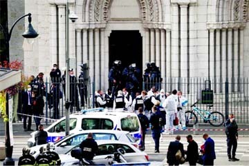 Security forces guard the area after a reported knife attack at Notre Dame church in Nice, France on Thursday.