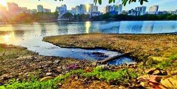 Wastewater finds its way into the Gulshan-Banani-Baridhara Lake in the capital due to lack of enforcement of law and coordination among civic bodies. This photo was taken from the Badda area on Saturday.