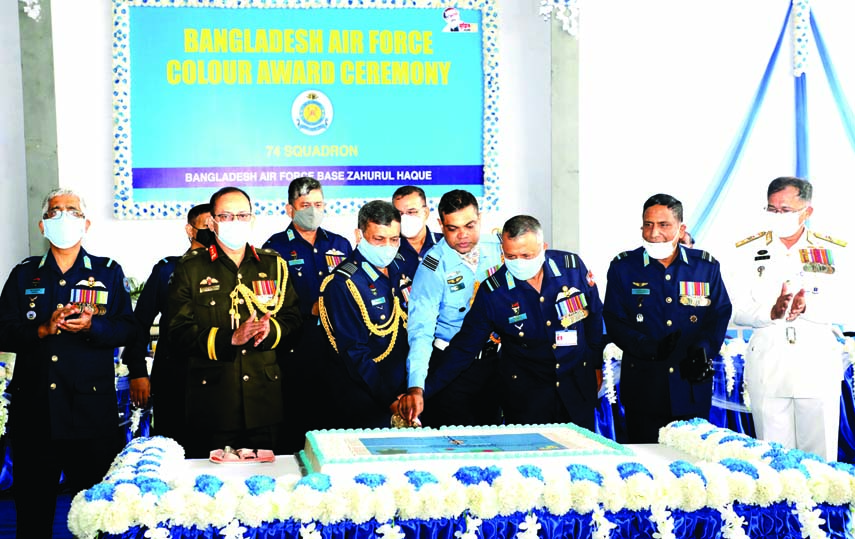 Chief of Air Staff Marshal Masihuzzaman Serniabat cuts a cake on the occasion of Colour Award Ceremony to hand over 'BAF Flag' to 74 No Contingent under BAF Zahurul Haq Base in the Port City on Sunday. ISPR photo