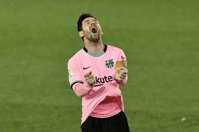 Barcelona's Lionel Messi gestures during the Spanish La Liga soccer match against Alaves at Mendizorroza stadium in Vitoria, Spain on Saturday.