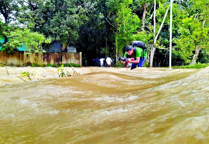 Five villages of Fulgazi union in Feni district go under water due to collapse of embankment on Muhuri River following onrush of water from upstream. This photo was taken from Doulatpur under Sadar union on Sunday.