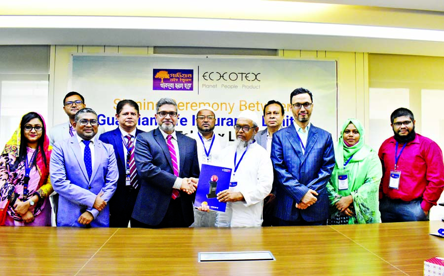 M M Monirul Alam, CEO of Guardian Life Insurance Limited (GLIL) and Syed Abdul Mannan, Finance Director of Echotex Limited, exchanging an agreement signing document at GLIL head office in the city recently. Under the deal, all the employees of Echotex wil