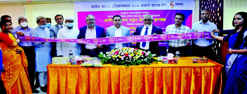 Mohammad Aiyub, Director of South Bangla Agriculture and Commerce (SBAC) Bank Limited, inaugurating its shifted branch at Station Road in Bhatiary in Sitakunda, Chattogram. Mohammad Salim Chowdhury, Md. Mamunur Rashid Molla, DMDs of the bank and local eli