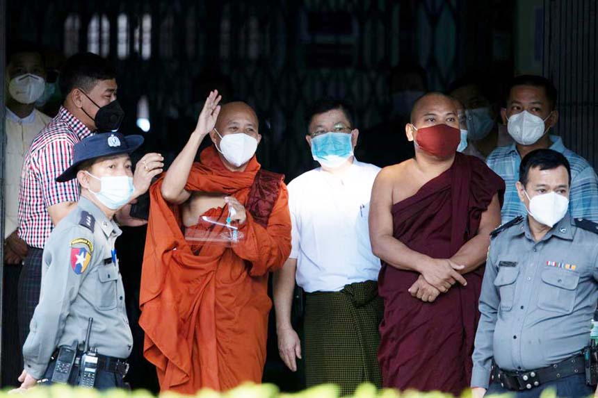 Fugitive Buddhist nationalist monk Wirathu hands himself in at a police station in Yangon, Myanmar on Monday.