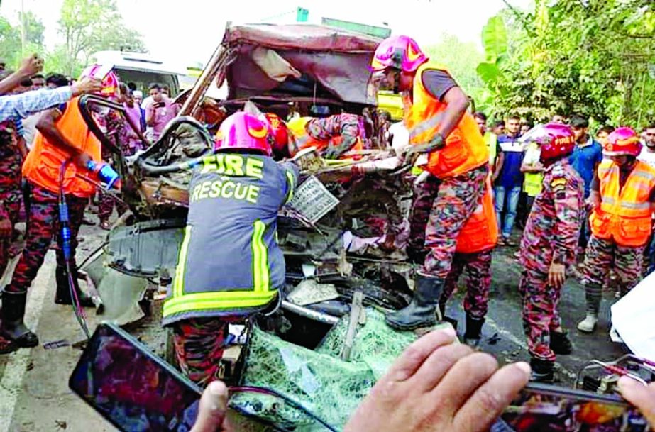 Fire service personnel conduct rescue operation to a crash between an ambulance and a truck on the Kushtia-Jhenaidah Highway at Lakshmipur-Niyatmor in Bittipara on Tuesday.