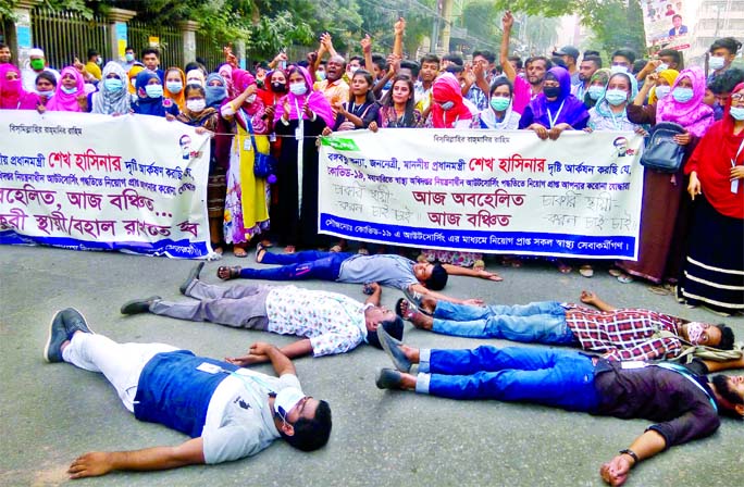 Health workers stage a demonstration in front of Health Directorate in the capital on Wednesday demanding regularization of their jobs.