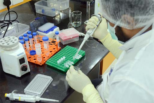 A scientist works inside a laboratory of the Serum Institute of India in Pune city.
