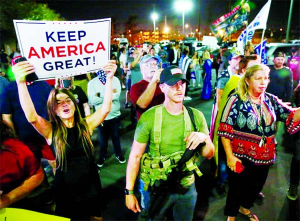 Supporters of US President Donald Trump gather in front of the Maricopa County Tabulation and Election Center to protest against the early results of the 2020 presidential election, in Phoenix.