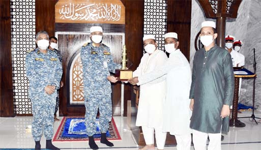 Regional Commander of Khulna Navy Rear Admiral Mohammad Musa hands over prizes among the winners of Qirat and Azan competitions of Bangladesh Navy at BNS Titumir Mosque in Khulna on Friday.