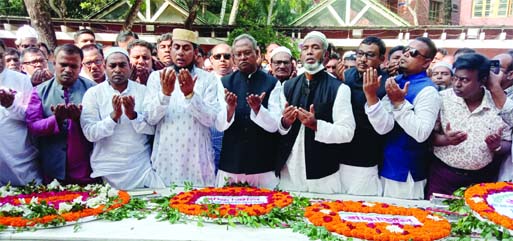 Leaders and activists of Naogaon district Awami League (AL) led by Anwar Hossain Helal, newly-elected MP of Naogaon-6 constituency, pay tributes to Bangabandhu Sheikh Mujibur Rahman by placing wreaths at his mausoleum at Gopalganj's Tungipara on Friday.