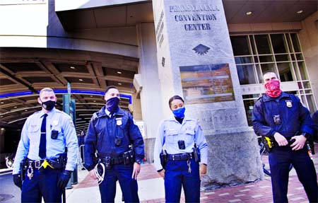 Police stand guard outside the Pennsylvania Convention Center in Philadelphia, Pennsylvania on Thursday.