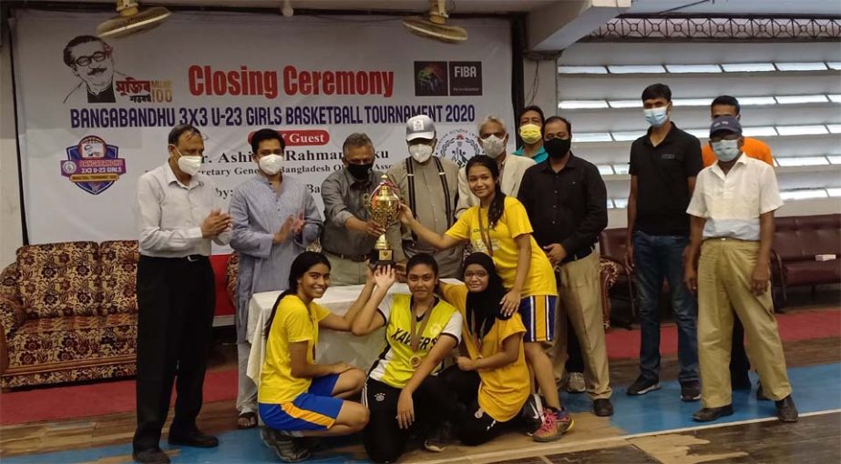 Members of Hornets SC, the champions in the Bangabandhu Under-23 (Girls') Three On Three Basketball Tournament with the chief guest Deputy-Secretary General of Bangladesh Olympic Association Asaduzzaman Kohinoor, special guest Director General of Banglad