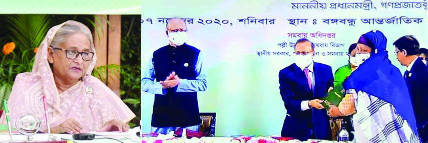 On behalf of Prime Minister Sheikh Hasina, LGRD and Cooperatives Minister Tajul Islam hands over National Cooperative Prize-2019 among the recipients at the Bangabandhu International Conference Center in the city on Saturday marking the National Cooperati