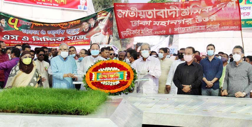 BNP Secretary General Mirza Fakhrul Islam Alamgir along with party colleagues places floral wreaths on the mazar of late President Ziaur Rahman in the city on Saturday marking National Revolution and Solidarity Day.