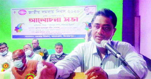 Dinajpur's Kaharole UNO Monirul Hasan speaks at a discussion in the upazila auditorium on Saturday marking the 49th National Cooperatives Day.