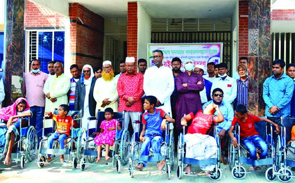 A total of 12 wheelchairs were distributed among physically challenged persons in Madarganj upazila of Jamalpur district at a simple ceremony on Saturday. Mustafizur Rahman Raja, President of Mozzammel-Momtaz Kalyan Sangstha and Tabibur Rahman Suruj, Vic