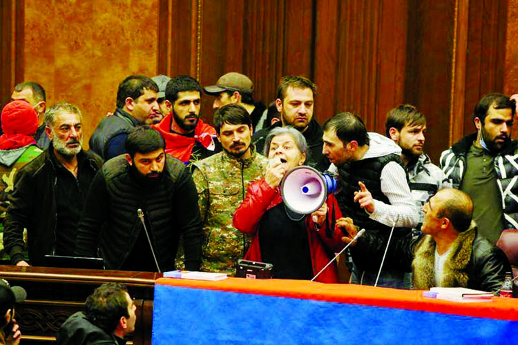 People storm the parliament, after Armenian Prime Minister Nikol Pashinyan said he had signed an agreement with leaders of Russia and Azerbaijan to end the war on Tuesday, in Yerevan Armenia on Tuesday.