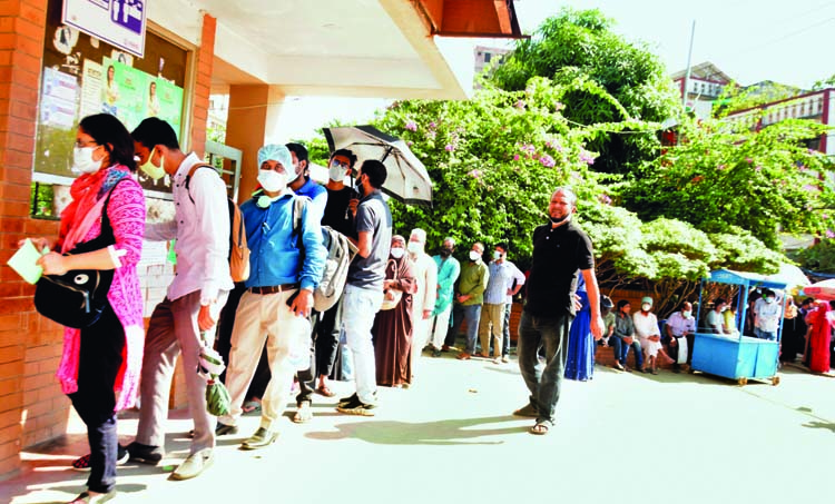 People flock to the capital's Mugda General Hospital on Tuesday for corona test amid rising fear of a second wave of virus infection.