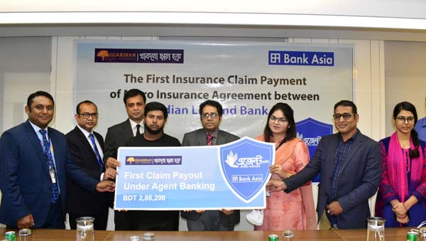 Sardar Akhtar Hamid, SEVP and Head of Channel Banking Division of Bank Asia Limited and Mohammad Sajjadul Karim, DMD of Guardian Life Insurance Limited, handing over a claim cheque to Robin Mahmood, nominee under their micro insurance agreement at the ban