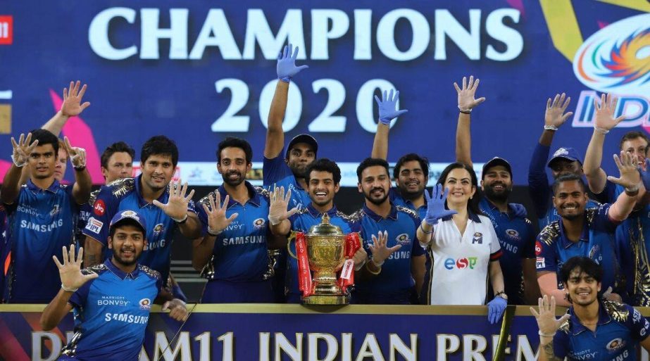 Members of Mumbai Indians pose for a photo session with the IPL trophy 2020 after beating Delhi Capitals by five wickets in the final of the Indian Premier League (IPL) in Dubai on Tuesday.