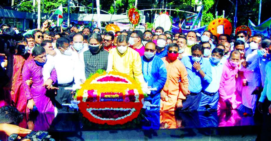 Chairman of Bangladesh Awami Juba League Sheikh Fazle Shams Parosh pays floral tributes on the portrait of Father of the Nation Bangabandhu Sheikh Mujibur Rahman in the city's 32, Dhanmondi on Wednesday marking its 48th founding anniversary.