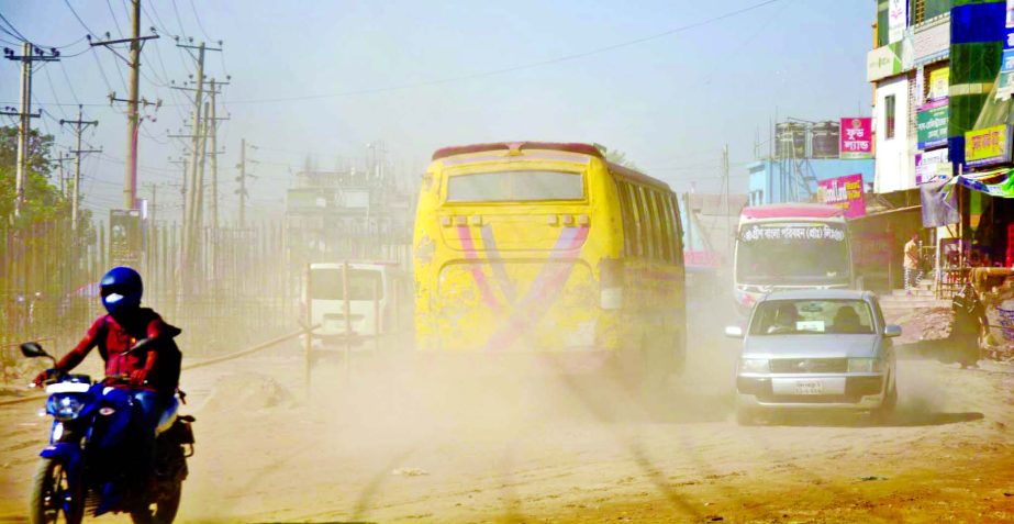 Thick layer of dust makes the Dhaka-Sylhet Road at Konapara almost invisible, posing risk of road accidents. This photo was taken on Wednesday.