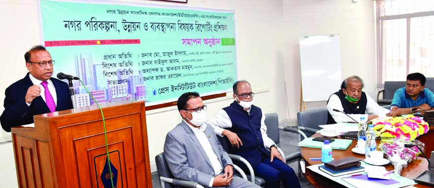 LGRD and Cooperatives Minister Tajul Islam speaks at the concluding ceremony of a training workshop about 'Reporting on Urban Planning, Development and Management' at PIB seminar room in the city on Thursday.