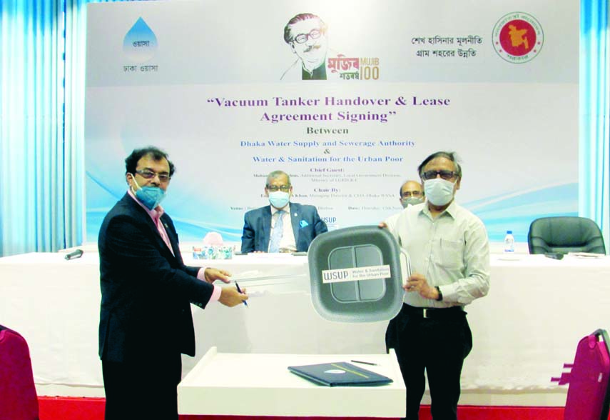 Managing Director of Dhaka WASA Engineer Taqsem A Khan, its Commercial Manager Uttam Kumar Roy and Country Programme Manager of WSUP Bangladesh Abdus Shahid at the signing ceremony of an agreement titled "Vacuum Tank Handover and Lease Agreement" betwee