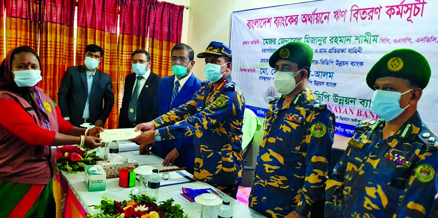 Major General Mizanur Rahman Shamim, Director General of the Bangladesh Ansar & Village Defense Party and Chairman of Ansar-VDP Unnayan Bank, disbusting loan among the clients of Thakurgaon branch of the bank recently. Md Shahbuddin, Deputy Director Gener