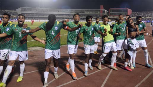 Players of Bangladesh celebrating after Mahbubur Rahman Sufil (second from right) scoring his sides second goal against Nepal during the first match of the ' Mujib Borsho' FIFA International Football Series at the flood-lit Bangabandhu National Stadium