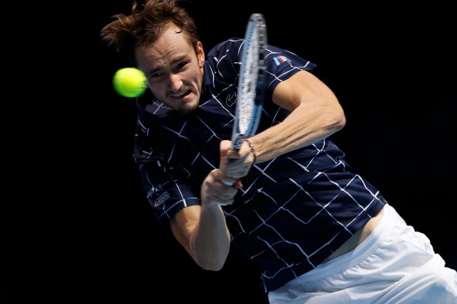 Medvedev of Russia plays a return to Alexander Zverev of Germany during their singles tennis match at the ATP World Finals tennis tournament at the O2 arena in London on Monday.