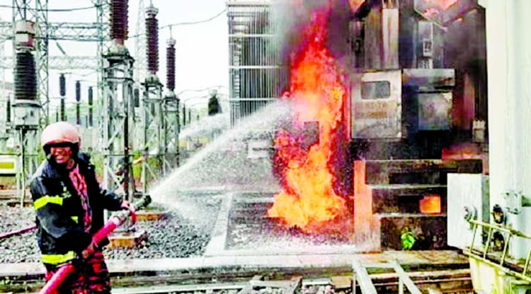 A firefighter tries to extinguish fire at the Kumargaon Power Plant in Sylhet on Tuesday.