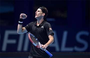 Austria's Dominic Thiem celebrates winning against Spain's Rafael Nadal in their men's singles round-robin match on day three of the ATP World Tour Finals tennis tournament at the O2 Arena in London on Tuesday.