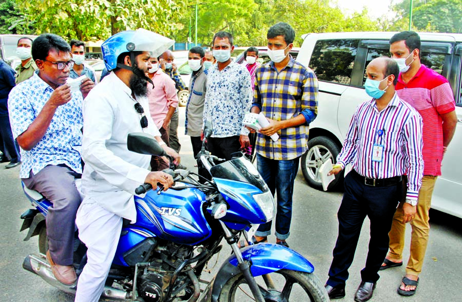 A biker was stopped by a Dhaka district administration's magistrate for moving without a mask during a mobile court operation at Abdul Gani Road intersection in the capital on Wednesday amid the second wave of novel coronavirus outbreak in the country.