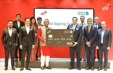 Mahtab Uddin Ahmed, Managing Director and CEO of Robi and Naser Ezaz Bijoy, Chief Executive Officer of Standard Chartered Bank, exchanging an agreement signing document for launch a co-branded credit card to provide innovative services to enterprise busin