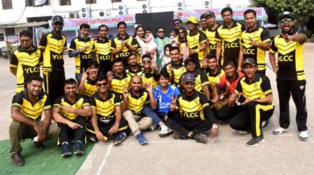 Members of Young Lawyers Cricket Club (YLCC) pose for a photo session in the Bangladesh Supreme Courtâ€™s Tarun Chattar on Friday. YLCC took part in the inaugural match of the Supreme Court Premier League.