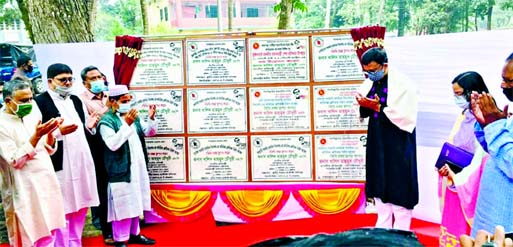 State Minister for Shipping Khalid Mahmud Chowdhury along with others offers Munajat after inaugurating some development works including nine primary schools and two roads at Bochaganj upazila in Dinajpur on Friday.