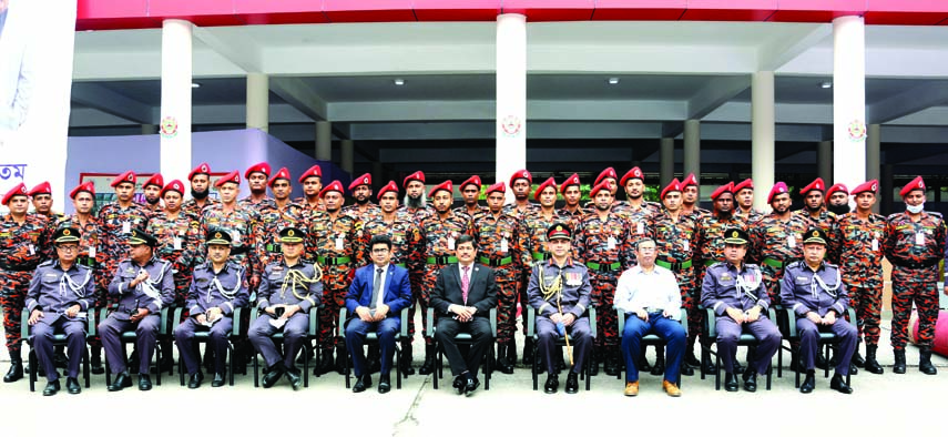 Secretary of Security Service Division of the Home Ministry Md. Shahiduzzaman and Director General of Fire Service and Civil Defence Directorate Brigadier General Sazzad Hossain, NDC, AFWC pose for photograph with winners of medals for their role in fire