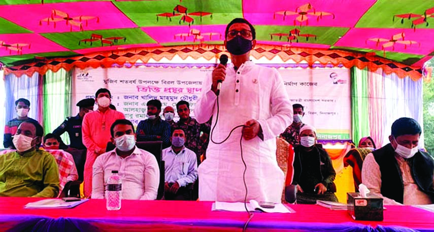 State Minister for Shipping Khalid Mahmud Chowdhury speaks at meeting of elite organised on the foundation laying stone of house construction for landless people on the premises of Bijora High School of Biral Upazila in Dinajpur on Saturday.