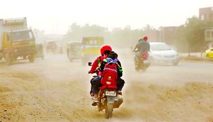 Bikers pass through a dusty road in the capital's Postogola area on Sunday.