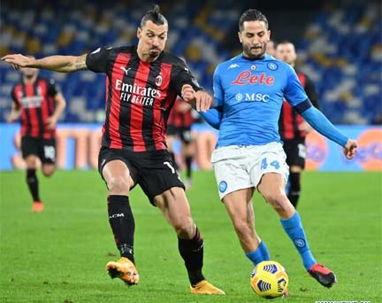 AC Milan's Zlatan Ibrahimovic (left) vies with Napoli's Kostas Manolas during a Serie A football match between Napoli and AC Milan in Naples, Italy on Sunday.