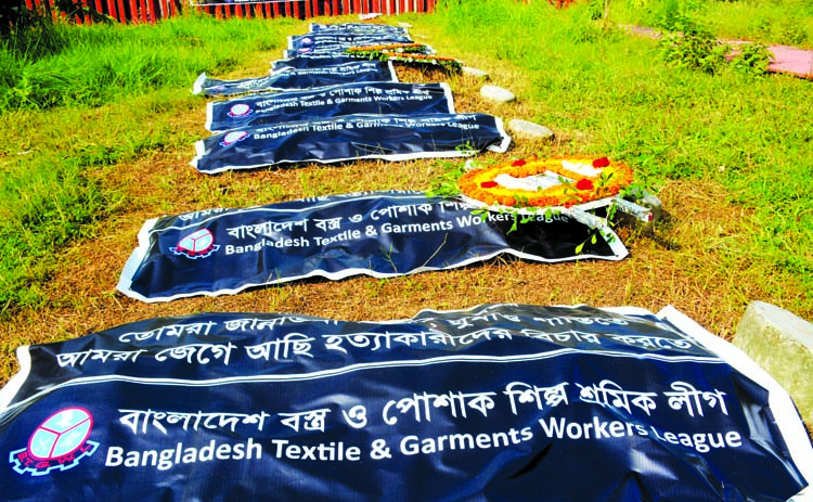 Different organisations including Bangladesh Textiles & Garments Workers League pay floral tributes in the city's Jurain Graveyard on Tuesday marking eighth years of fire incident in Tazreen Fashions.