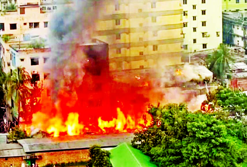 Smoke and flames billow from a massive fire that broke out at Bihari Potti on Babar road in the capital's Mohammadpur area on Tuesday.