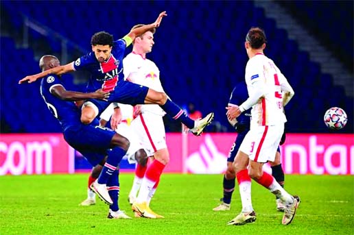 Paris Saint-Germain's Brazilian defender Marquinhos (2nd from left) jumps for the ball during the UEFA Champions League, Group H second-leg football match between Paris Saint-Germain (PSG) and RB Leipzig at the Parc des Princes stadium in Paris on Tuesda